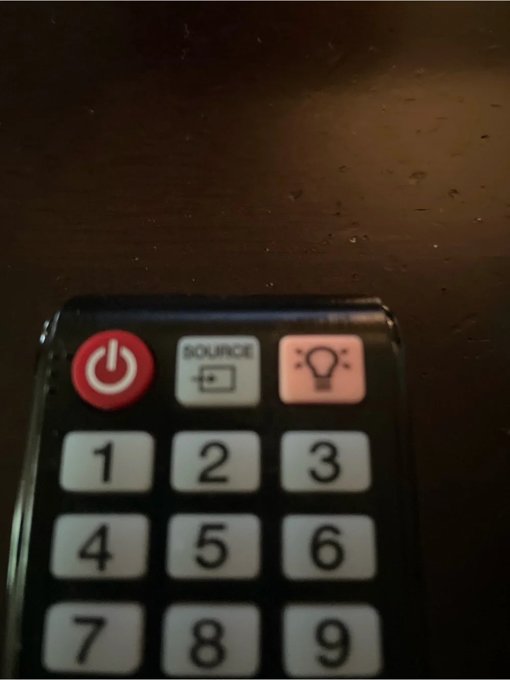 Samsung Black TV Remote with Light Blue Buttons